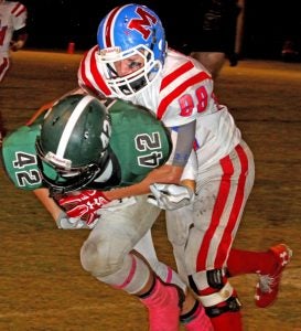 North Delta wide receiver John Haga Lewis is taken down by a Marshall player after attempting to gain positive yards. North Delta fell on the last play with a final score of 24-23. The Panolian Photo by Andy Young