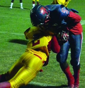 North Panola’s Jonathan Harris protects the ball as he scores one of his two touchdowns against Palmer Friday night. The Cougars went 7-0 with a 32-20 win over Palmer and will take its undefeated season on the road to district rival Charleston Friday night at 7 p.m. The Panolian photo by Ike House