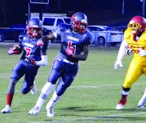 North Panola’s Sylvonta Oliver, No. 7, runs behind teammate Jamal Leverson against M. S. Palmer last Friday. The Cougars travel to take on Charleston tonight at 7 p.m. The Panolian photo by Ike House