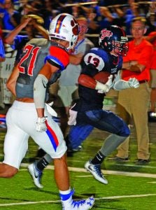 John Railey carries the ball for South Panola. The Panolian photo by Andy Young