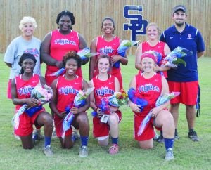 South Panola fastpitch seniors include (first row, l. to r.) Tra’Meisha Toliver, Madison Morgan, Lea Todd Ware, Morgan Parker; (back) head coach Kim Wilson, Tia Townsend, Sydney Morgan, Caitlyn Seay and asst. coach Sam Blaine.