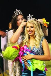 Sydney Claire Hall was crowned homecoming queen at North Delta School Friday night. Presenting her crown is  2015 queen Myles Durham. The Panolian photo by Glennie Pou