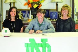 North Delta’s Will Kidder (center) signed a national letter of intent to play golf at Meridian Community College next season. Seated with him are Susan Lewis and his mother Jake Kidder. The Panolian photo by Myra Bean